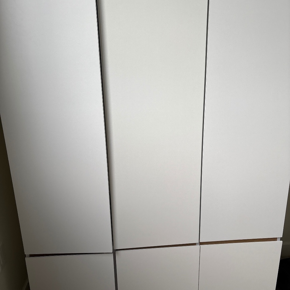 White closet with 6 doors
